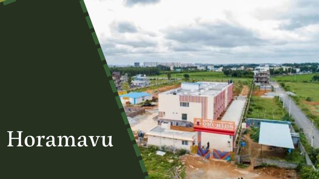 An aerial view of a building in a partly constructed or rural area with greenery and a partly cloudy sky. The text "Horamavu" is displayed on a dark green background on the left side of the image, highlighting the presence of house construction companies in Bangalore.